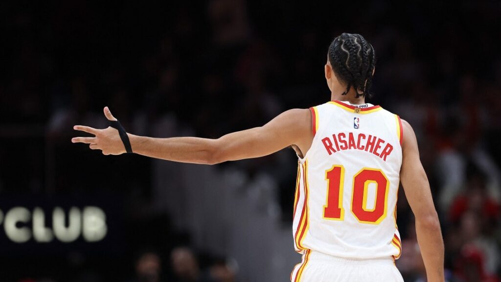 ATLANTA, GEORGIA - OCTOBER 16: Zaccharie Risacher #10 of the Atlanta Hawks reacts after a three-point basket against the Houston Rockets during the fourth quarter at State Farm Arena on October 16, 2025 in Atlanta, Georgia. NOTE TO USER: User expressly acknowledges and agrees that, by downloading and or using this photograph, User is consenting to the terms and conditions of the Getty Images License Agreement. Kevin C. Cox/Getty Images/AFP (Photo by Kevin C. Cox / GETTY IMAGES NORTH AMERICA / Getty Images via AFP) NOTE TO USER: User exp